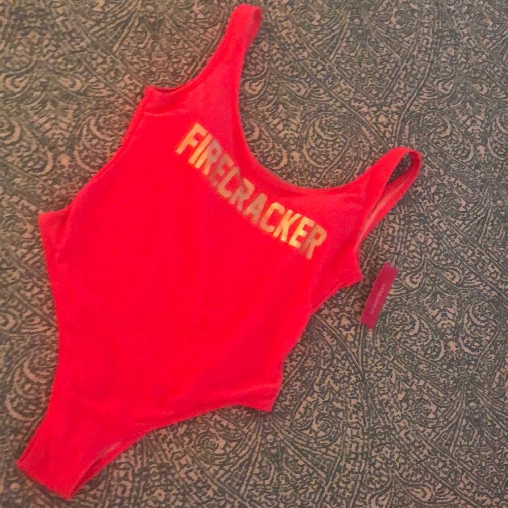 One piece neon swimsuit with high cut leg.